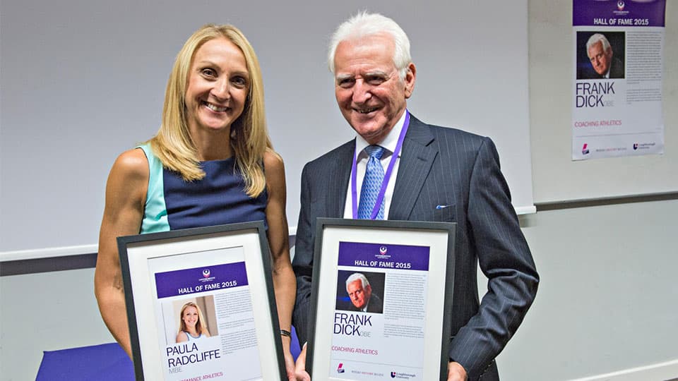 Paula Radcliffe holding Hall of Fame award in 2015 along with Frank Dick OBE.